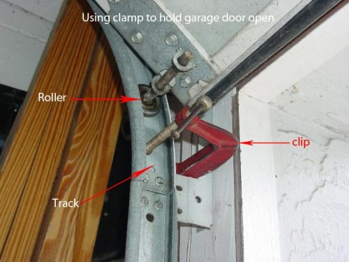 Using clamp to hold garage door open